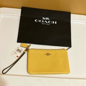 Coach sunlight pebble leather wristlet brass tone hardware zip closure
